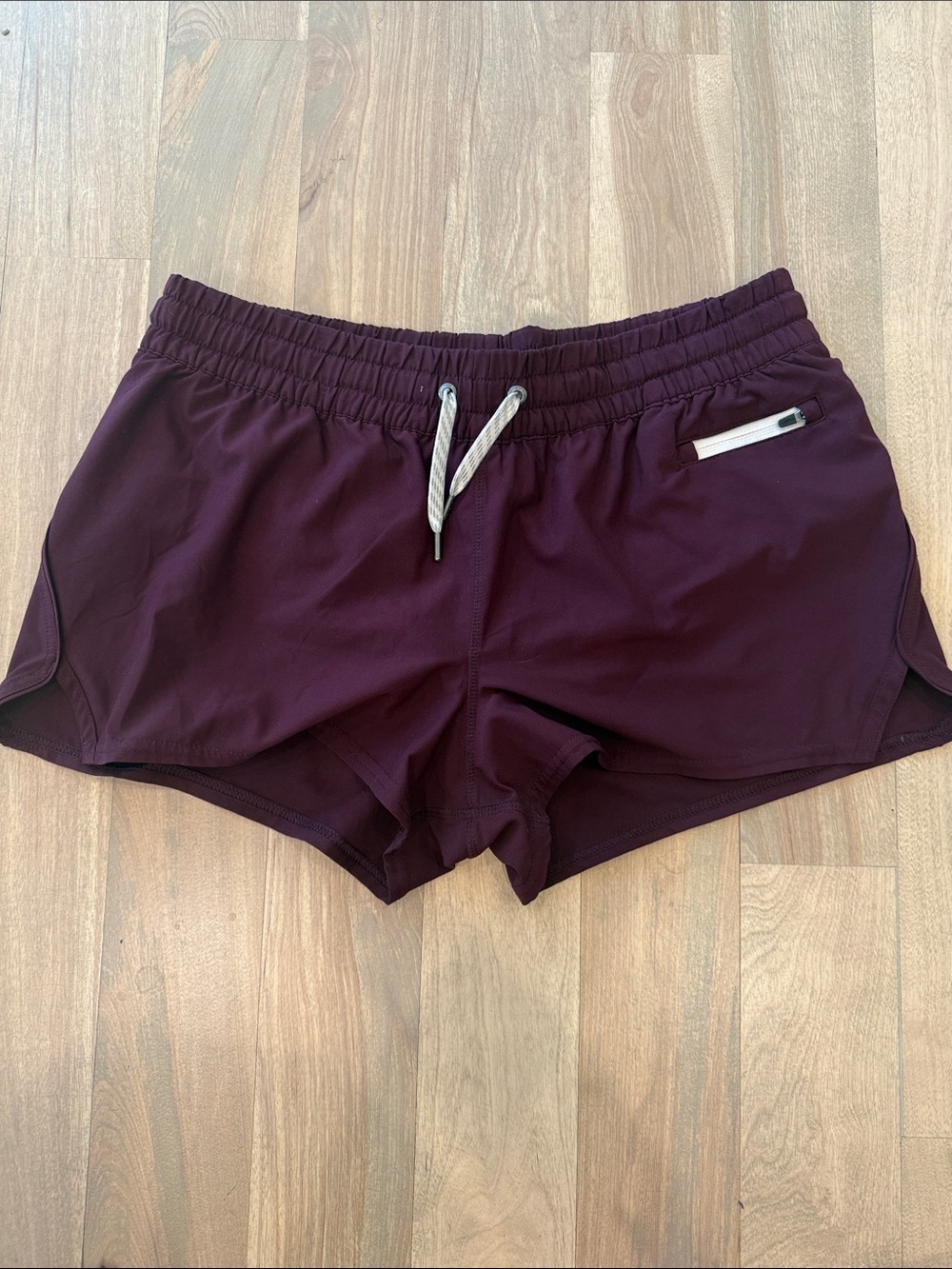Vuori Women's Athletic Shorts in Plum/Burgandy